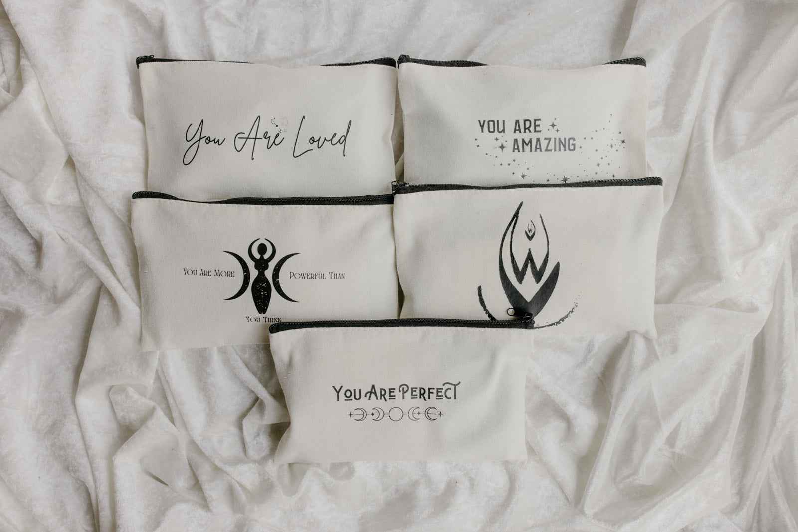 Menstrual Starter Kit Tween Period Supplies featuring black pouches with inspirational gold fonts.