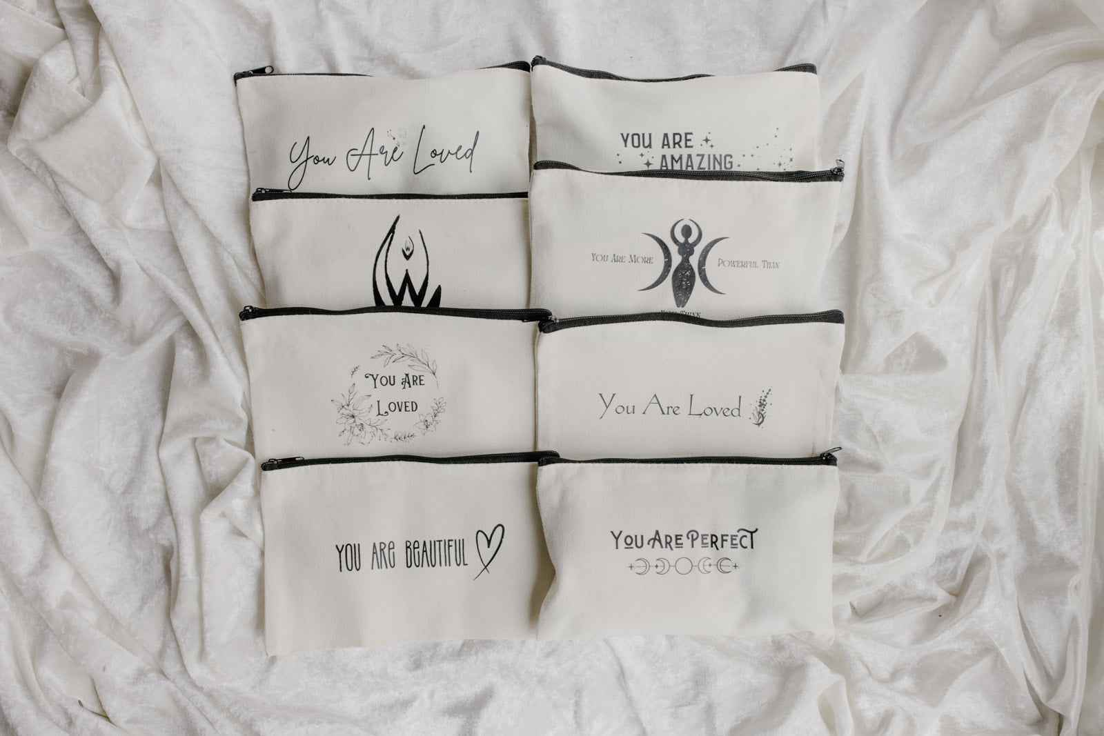 Menstrual Starter Kit Tween Period Supplies featuring black pouches with inspirational gold fonts.
