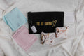 Menstrual Starter Kit Tween Period Supplies featuring black pouches with inspirational gold fonts.